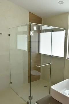 This photograph captures a section of the bathroom, specifically highlighting its shower area.