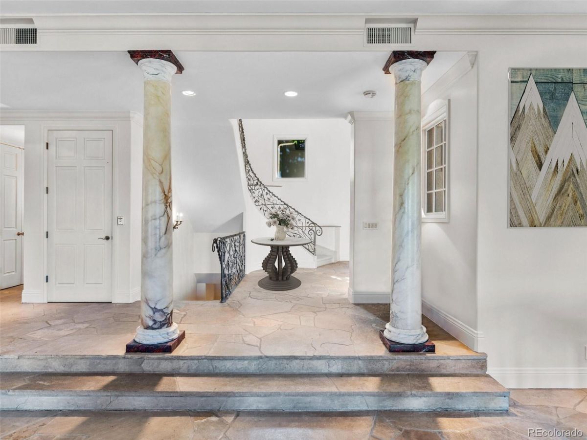 Upon entering, the curve staircase and the two Doric columns give off a classic feel to the house.