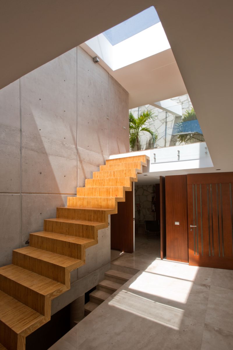 The stair illuminated by prism-shaped opening structures.