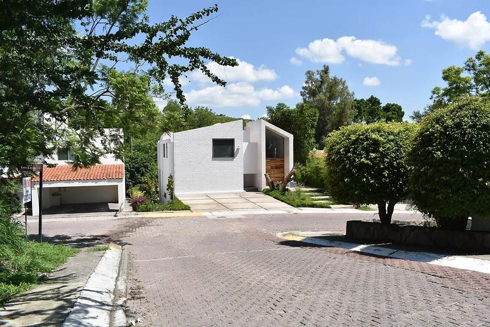 This is an exterior photograph of the Casa Veracrus House that was captured from a distance.