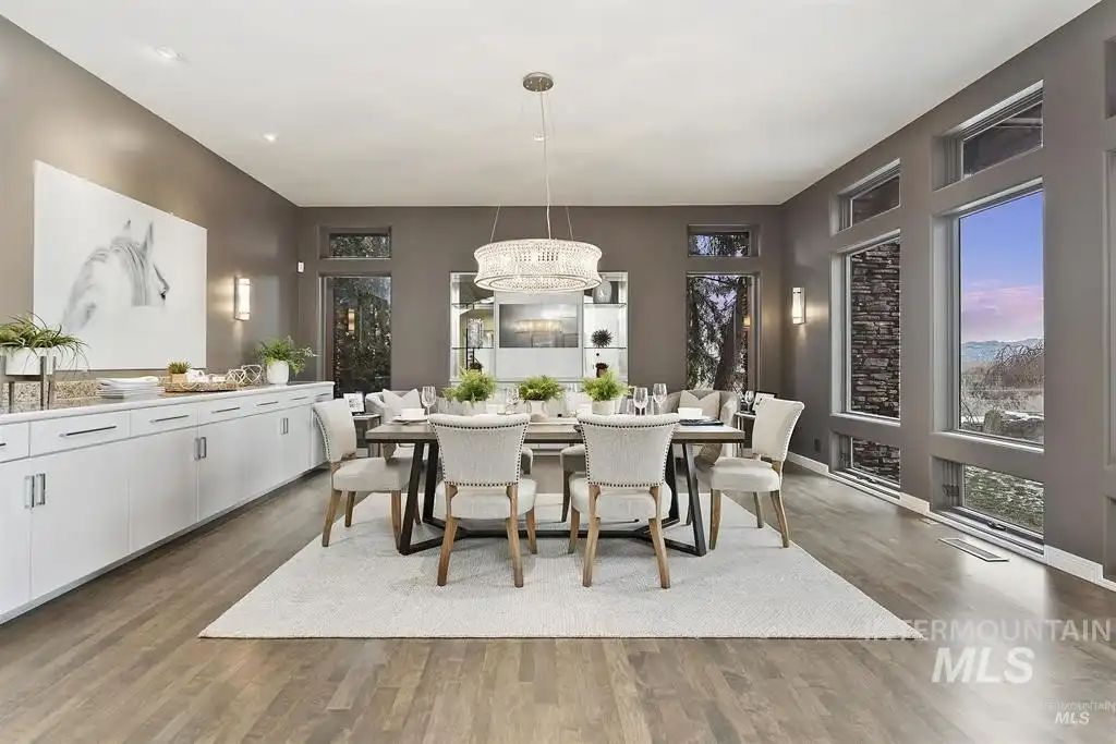 The formal dining area features a luxurious chandelier giving the room a luxurious feel.