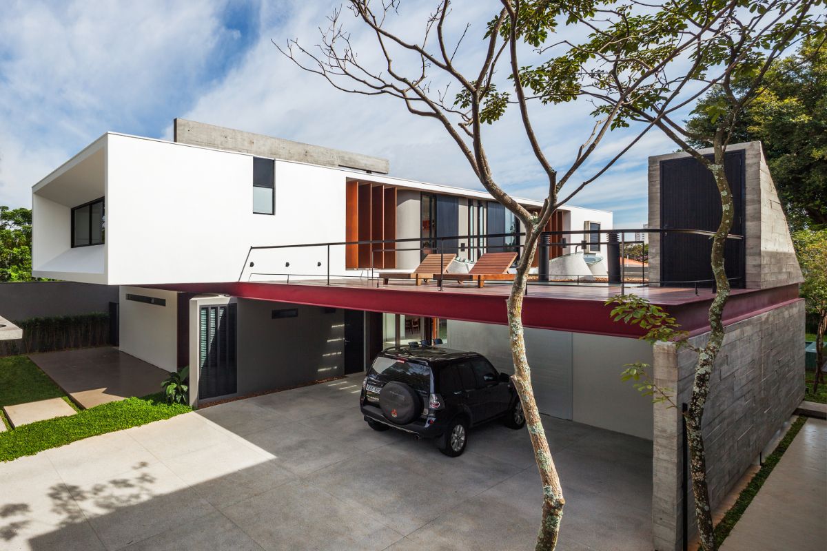 The garage is located inside the compound right below the deck with sun loungers.