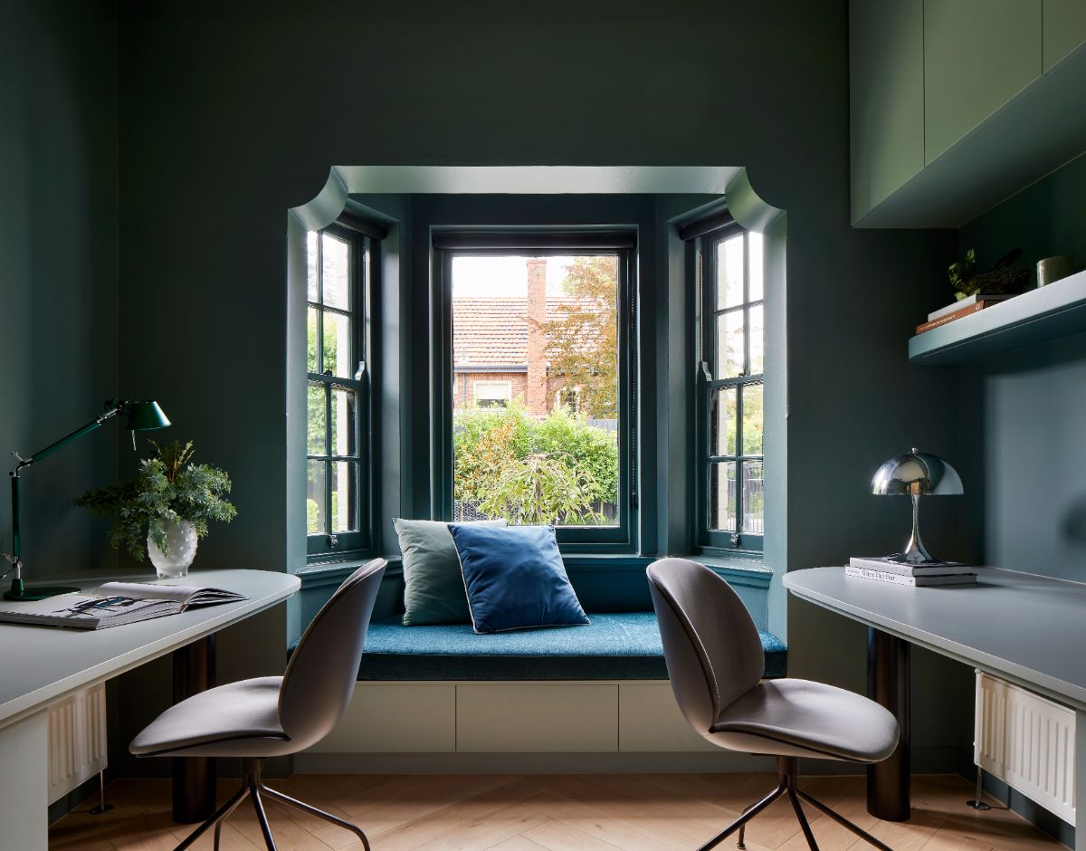 The study features a window seat which is perfect for relaxation after work.