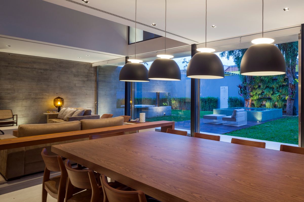 The dining room is decorated with beautiful pendant light giving the room a dramatic effect.