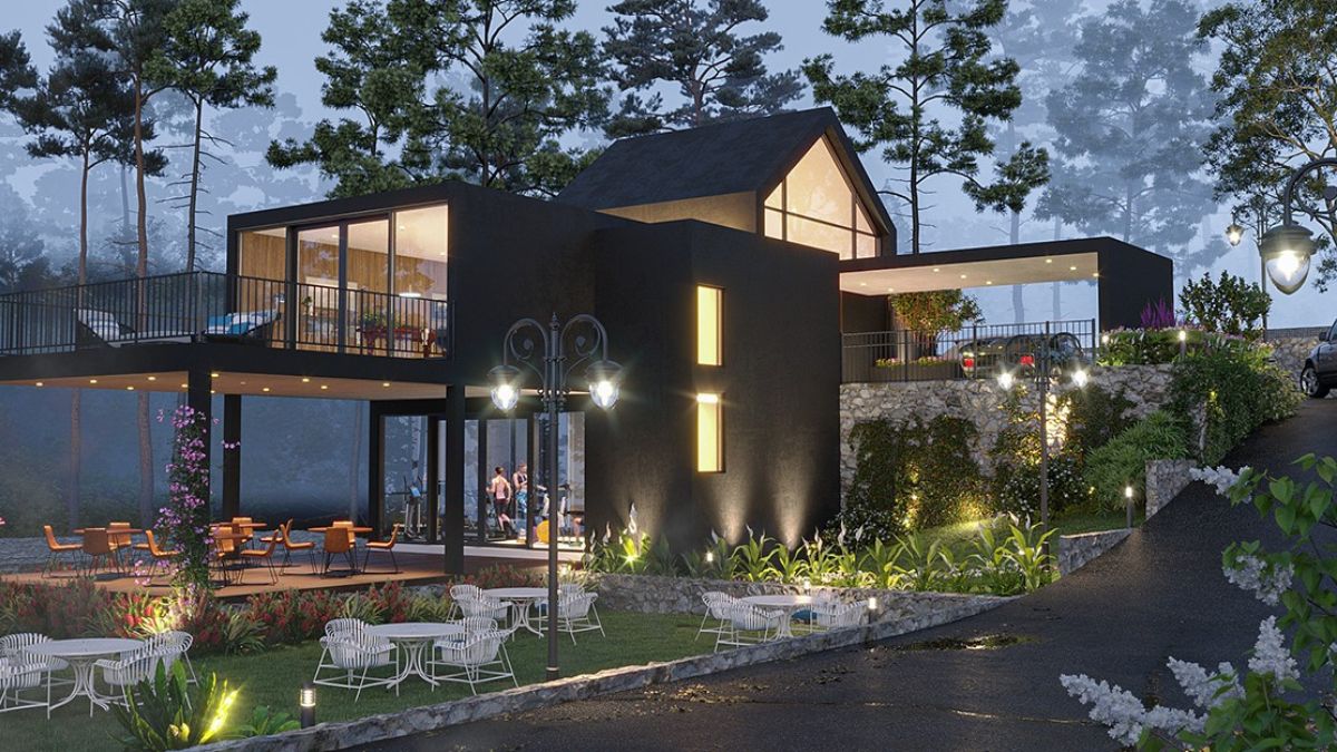 This is a modern building design that makes the most of its space with an open foyer. It also has a deck on the upper level where guests can relax and enjoy the forest surroundings.