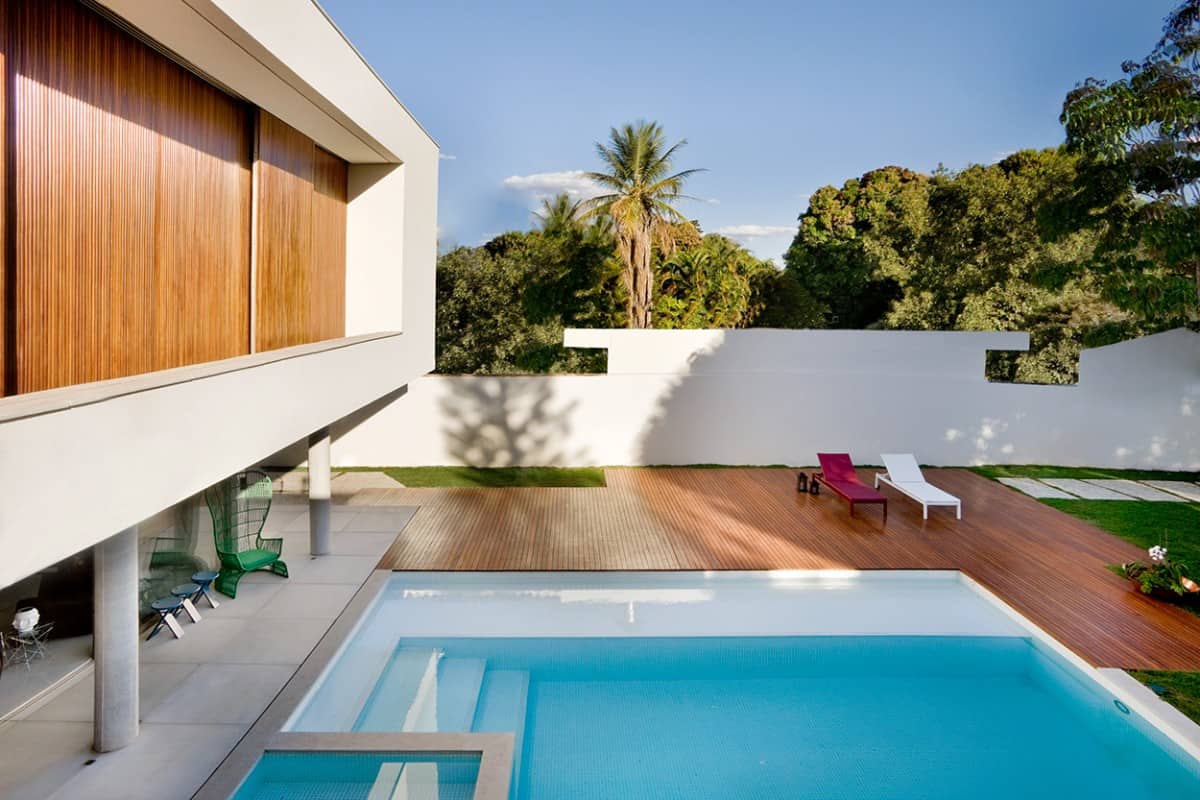 A pool terrace with a wooden deck provides a wonderful and cozy entertaining space.