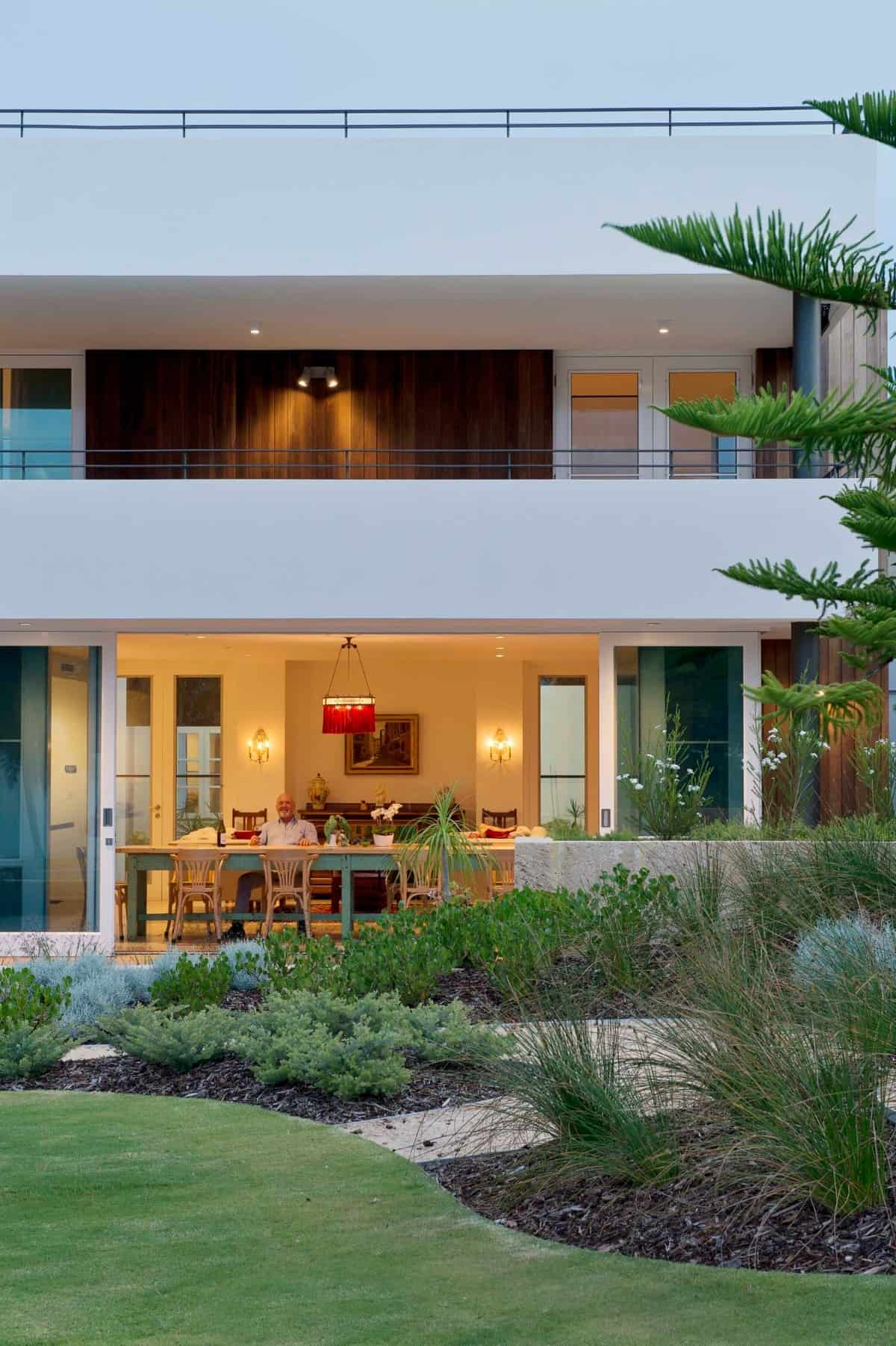 Oversized sliding glass doors create a seamless indoor-outdoor living.