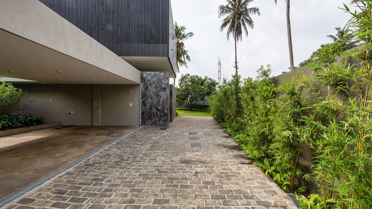 This image features the brick stone flooring of a pathway at the rear of the house, providing a glimpse into the exquisite design of the outdoor space.