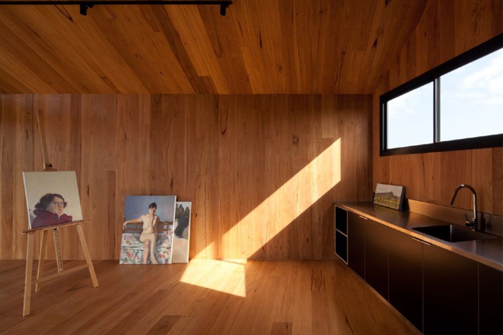 An interior shot featuring the kitchen area with a glass windows along the kitchen sink which offers a good ventilation and allowing natural light into the house.