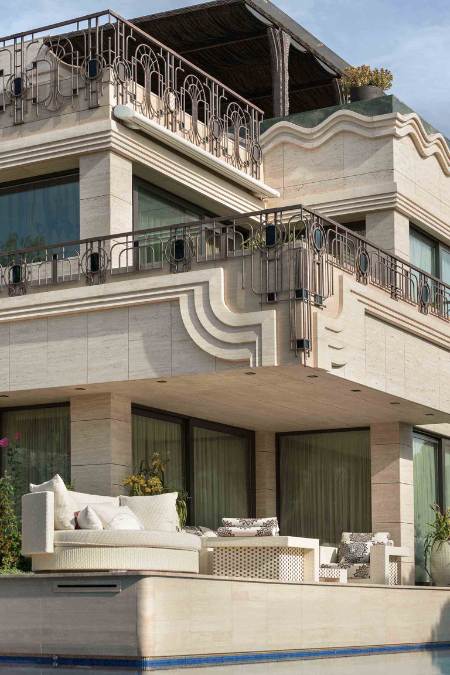 This portrait shot provides an overview of the house, showcasing its different floor levels and sections.