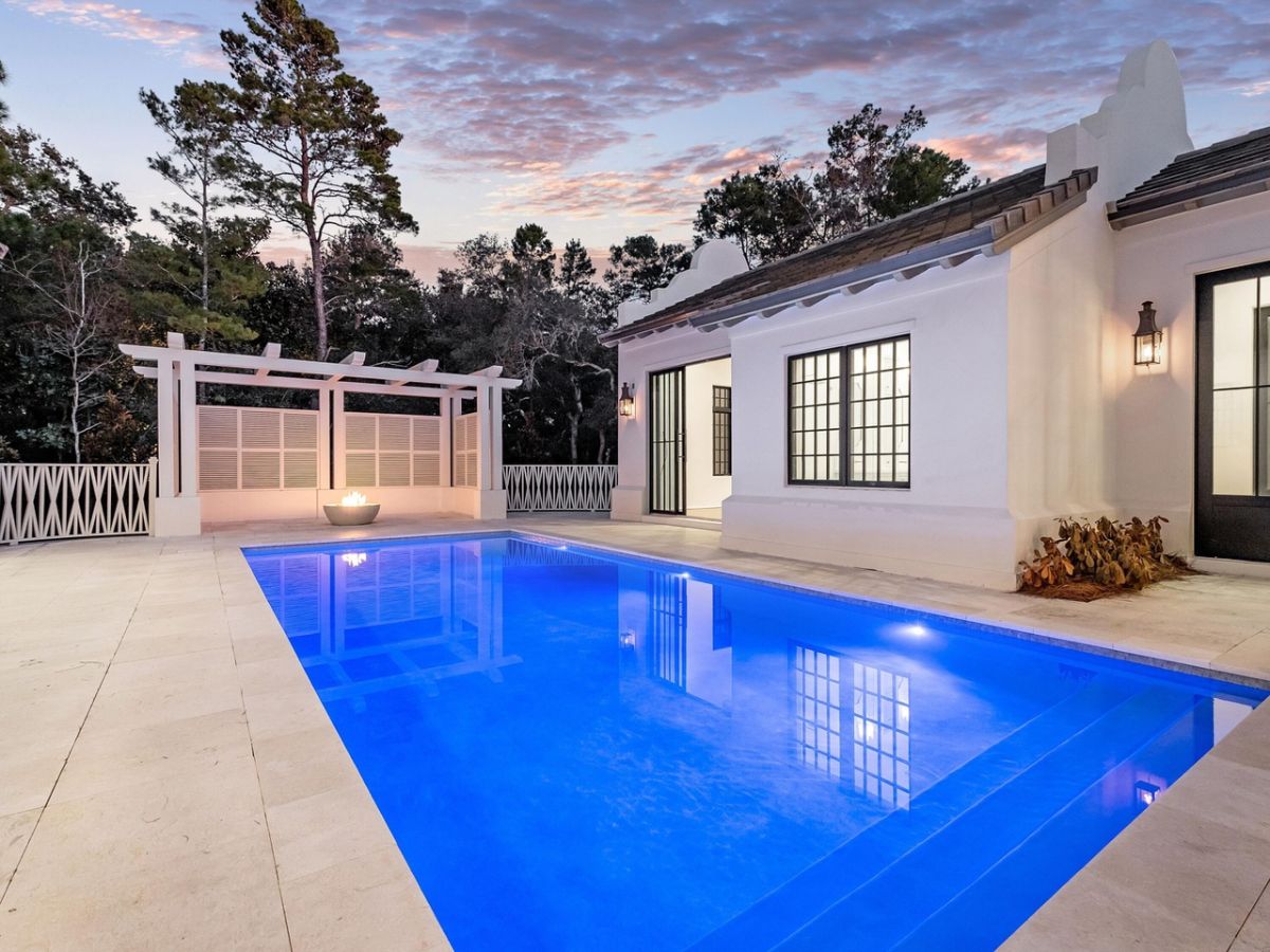 The house features a swimming pool, and the walls feature lightings that gives a dramatic effect.