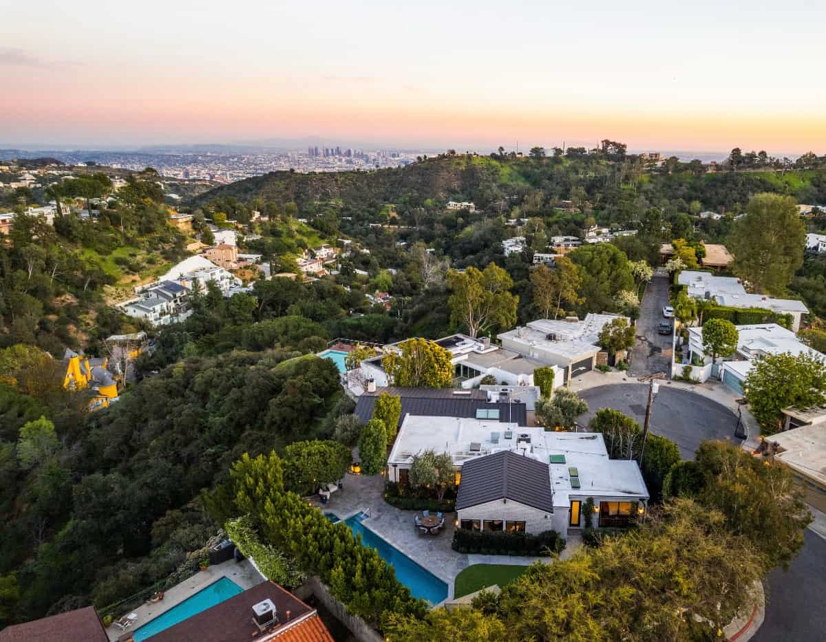 Aerial view of the house showcasing its outdoor spaces including the pool terrace.