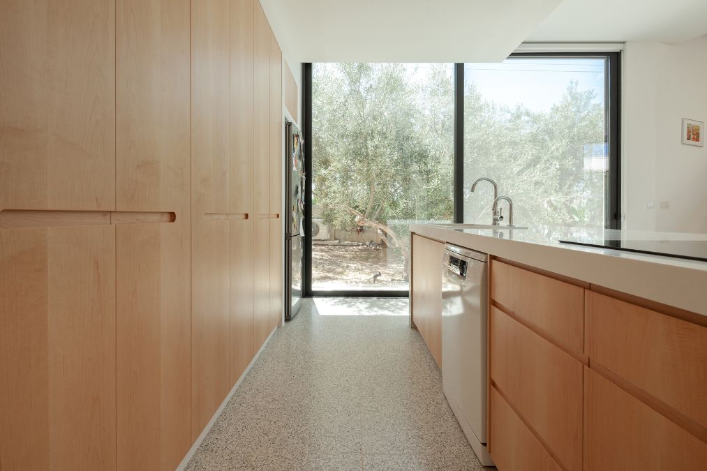 This is an interior photograph showcasing the interior design of the kitchen area, captured from an alternative viewpoint.