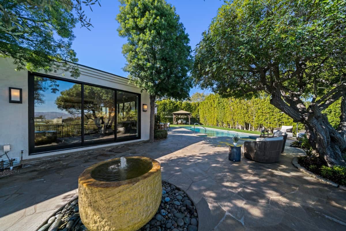 A round fountain sets a nice focal point on the flagstone patio.