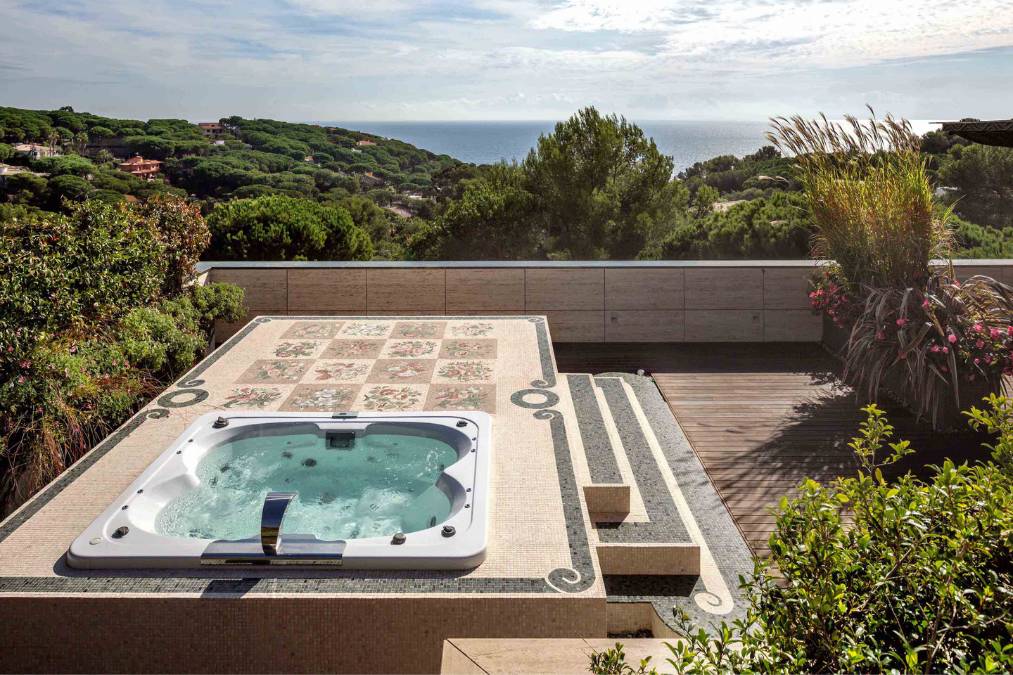 A jacuzzi has been constructed on the top deck, offering a scenic view of the surrounding area.