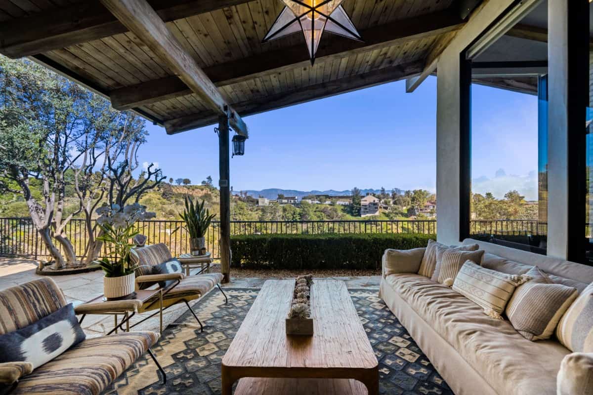 Views of the mountains, canyon, and city skyline can be enjoyed on the covered porch.