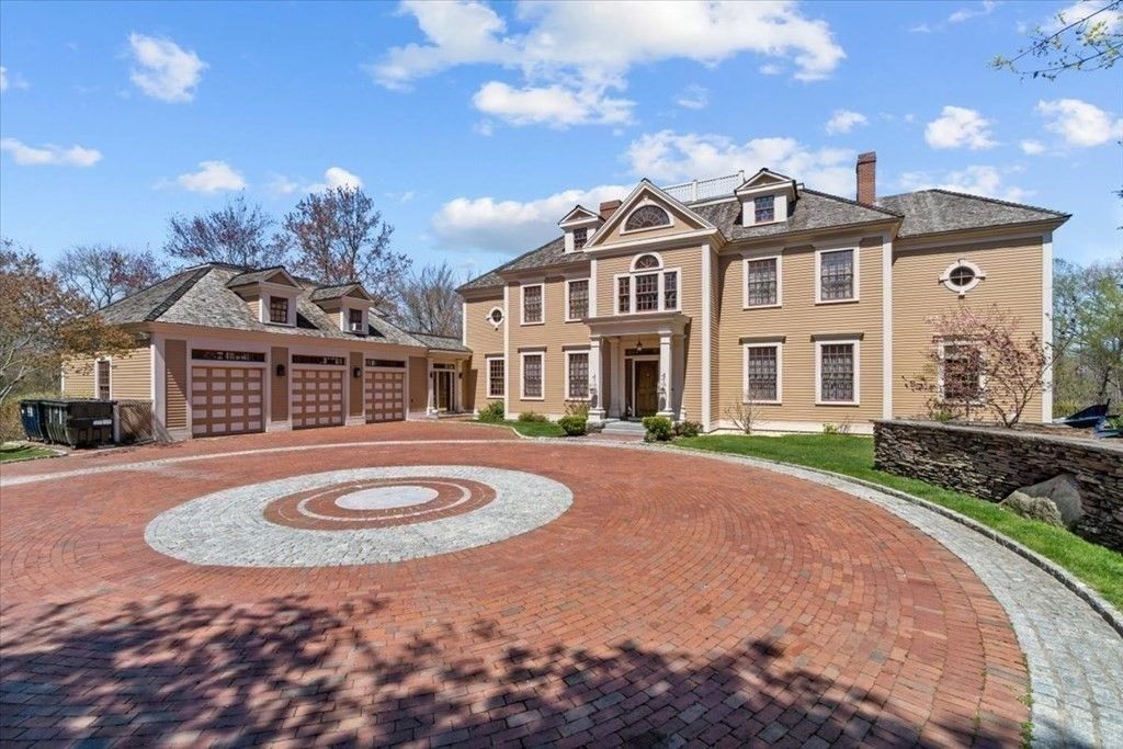 The house entrance features an attached garage and covered porch giving off a welcoming feel.