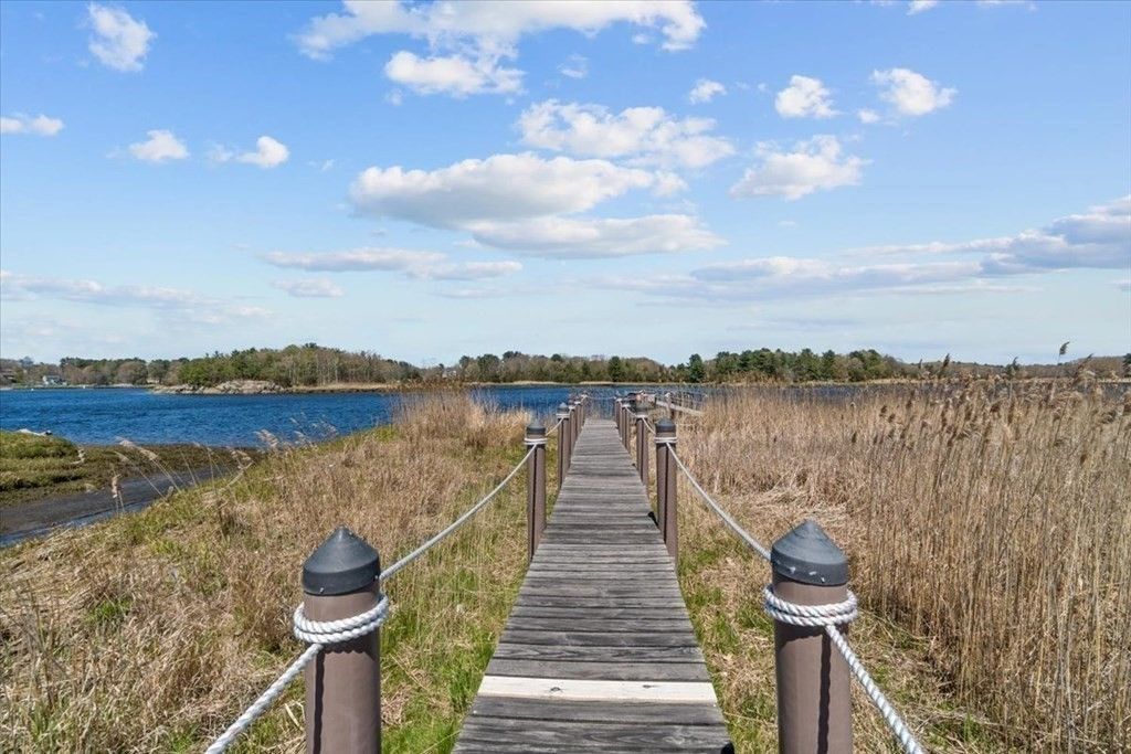 The house has access to the Merrimack river via a wooden dock.