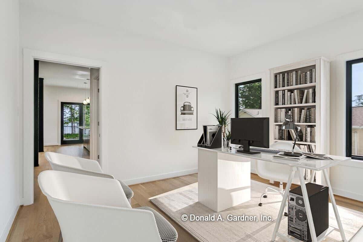 Home office with modern furnishings and a hardwood floor topped by a beige rug.