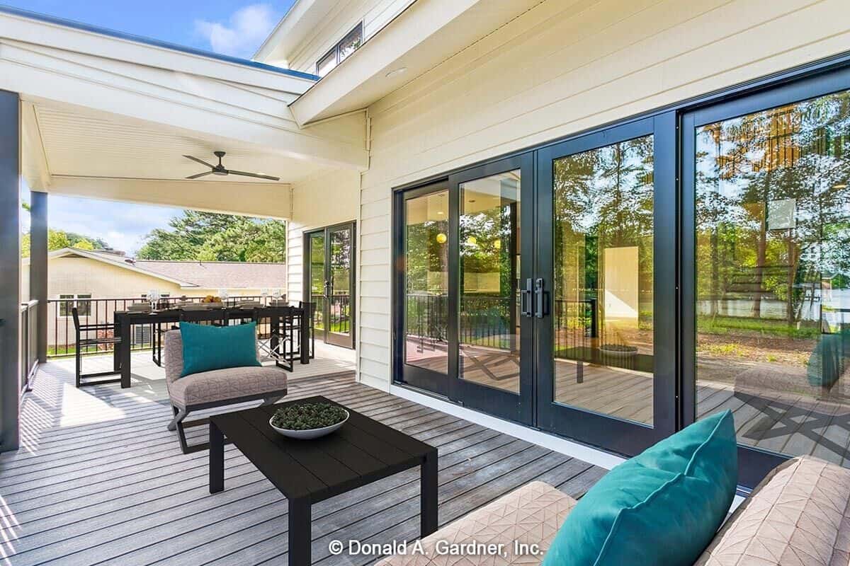 Partially covered deck filled with outdoor dining and living.