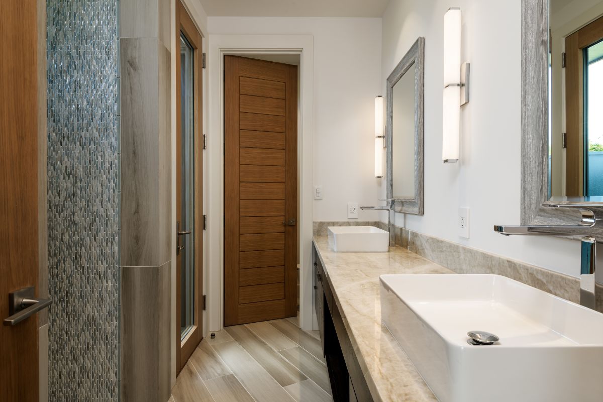 The bathroom features a vanity with a granite countertop and a vessel sink.