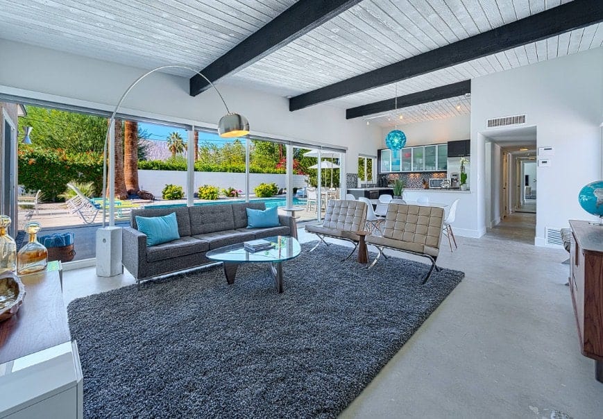 gray sofa with blue throw pillows