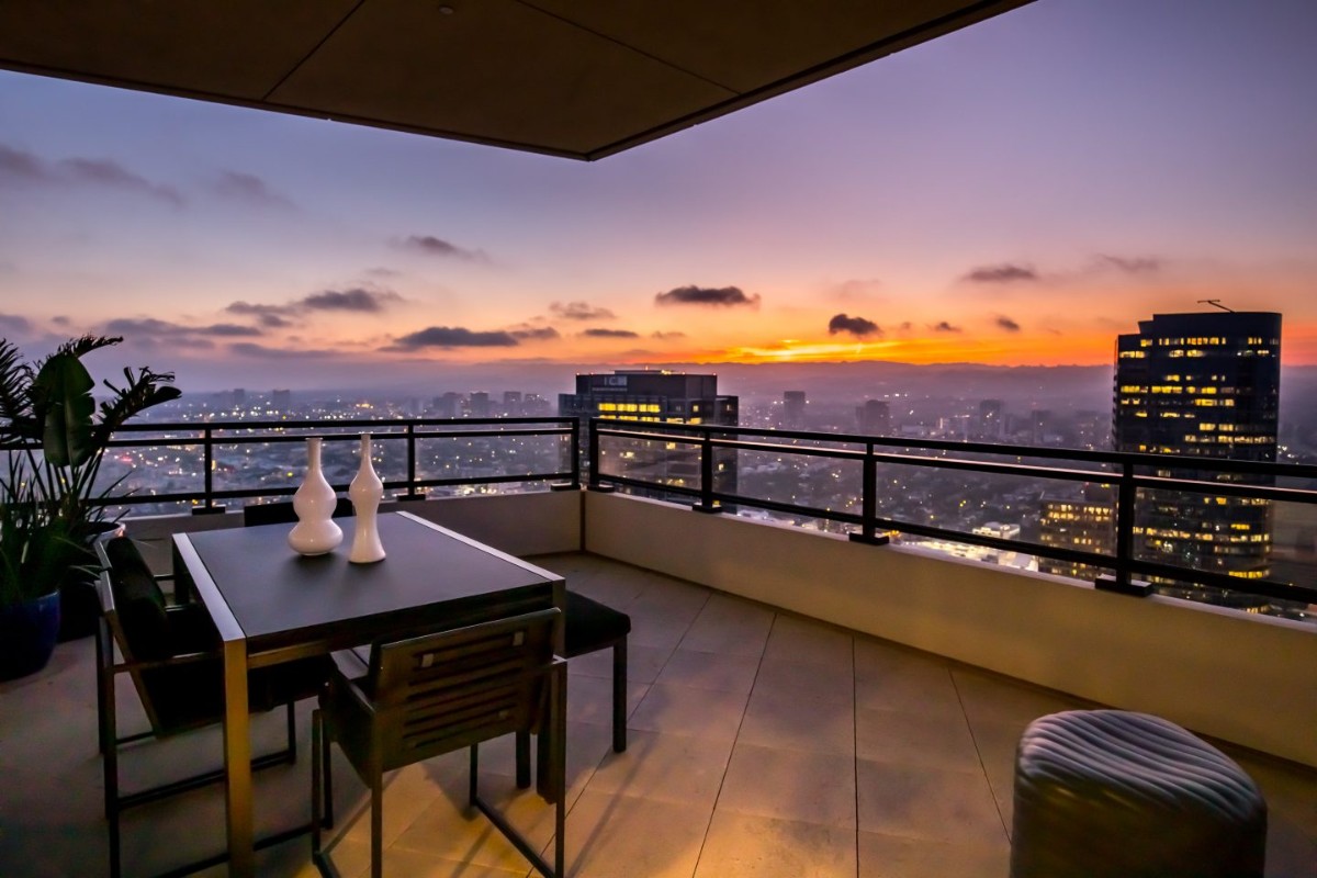 The mansion's covered balcony with stunning views over Los Angeles.