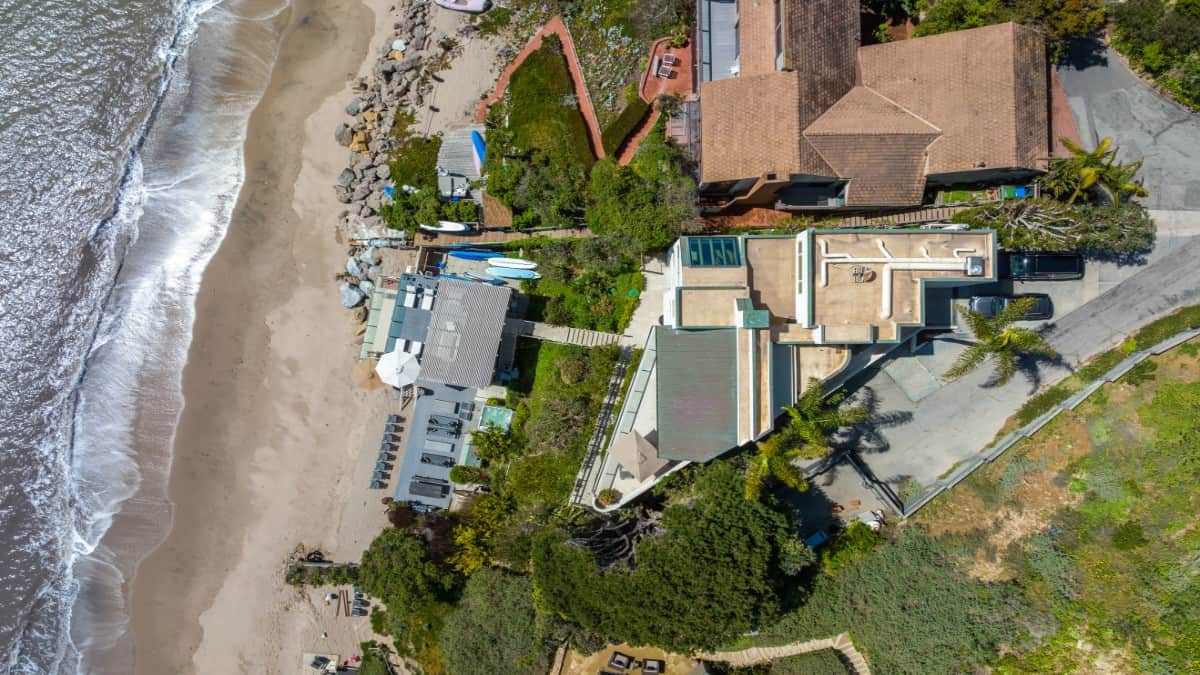 Bird's eye view of the beach house showcasing its perimeter and rooftop decks.