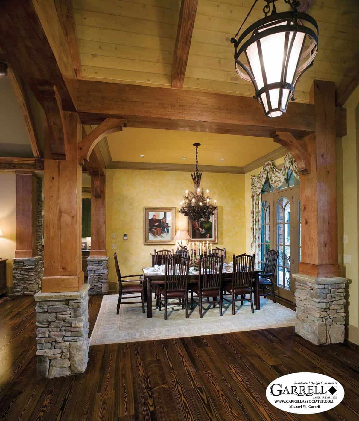 Formal dining room with a dark wood dining set and private access to the front porch via a glazed door.