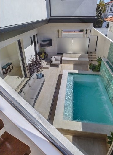 View of the pool terrace from the staircase.