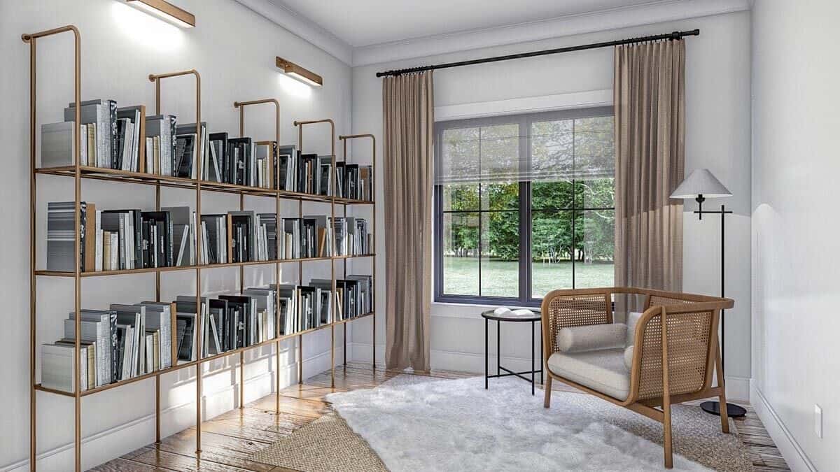 Home office with brass bookshelves and a rattan armchair sitting on layered rugs.