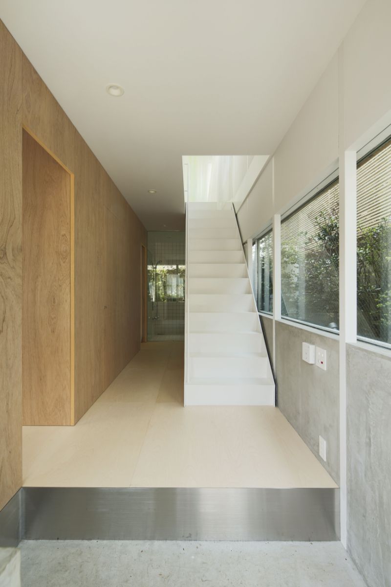 A stairway in the corridor leading to the second-floor open space.