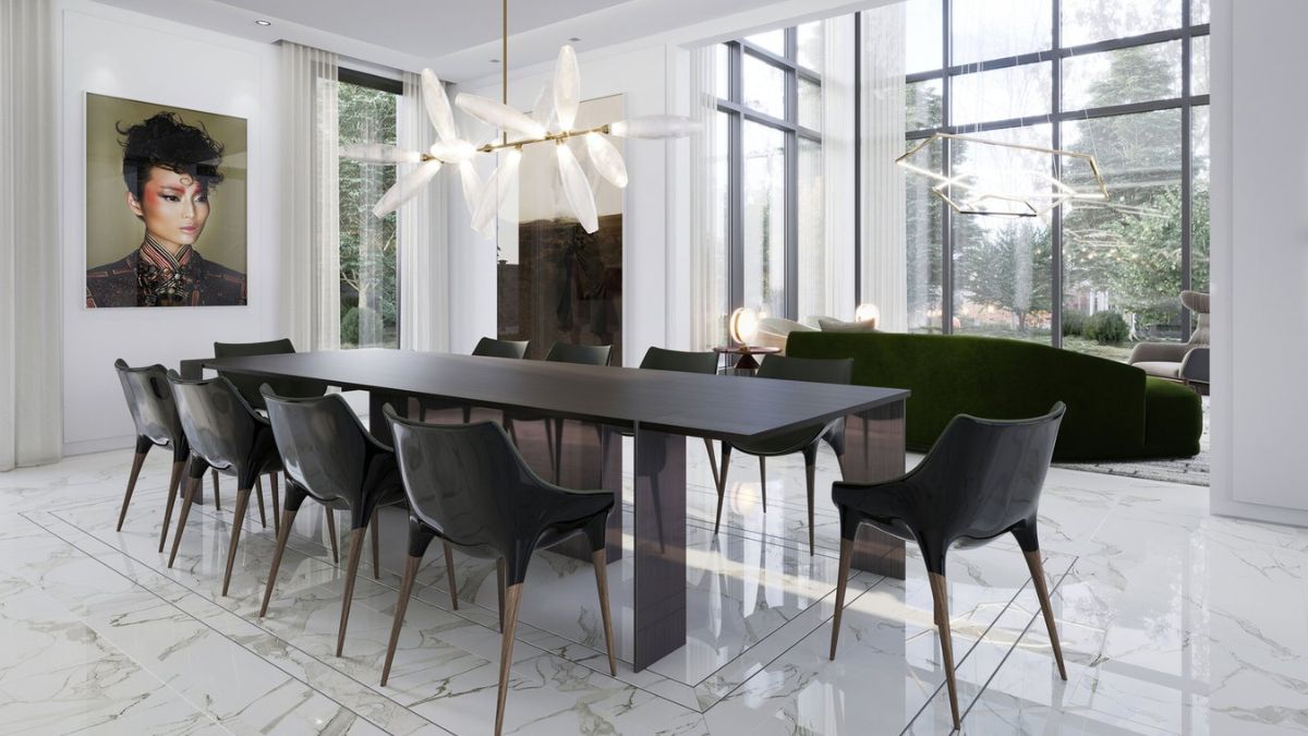 This long, dark table with a gorgeous chandelier is located near the main living area.