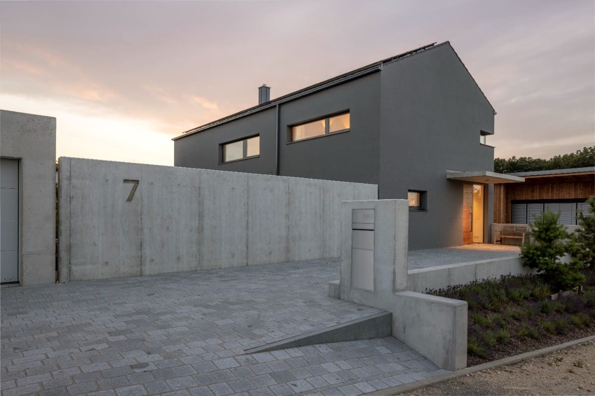 The concrete fence and gate provide privacy to the home.