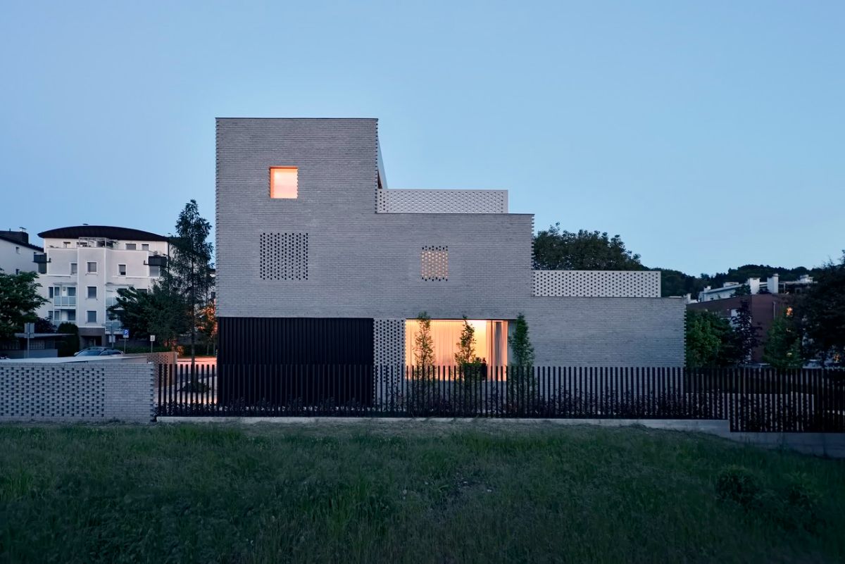 The side facade of the house showing the stepped geometry of the house that has an associated terrace.