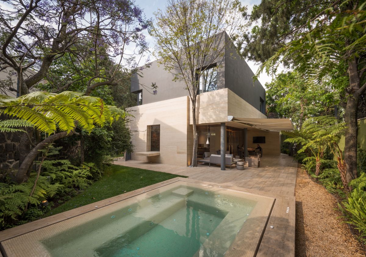 The Magnolia house's facade is made of wood, marble, and national travertine.