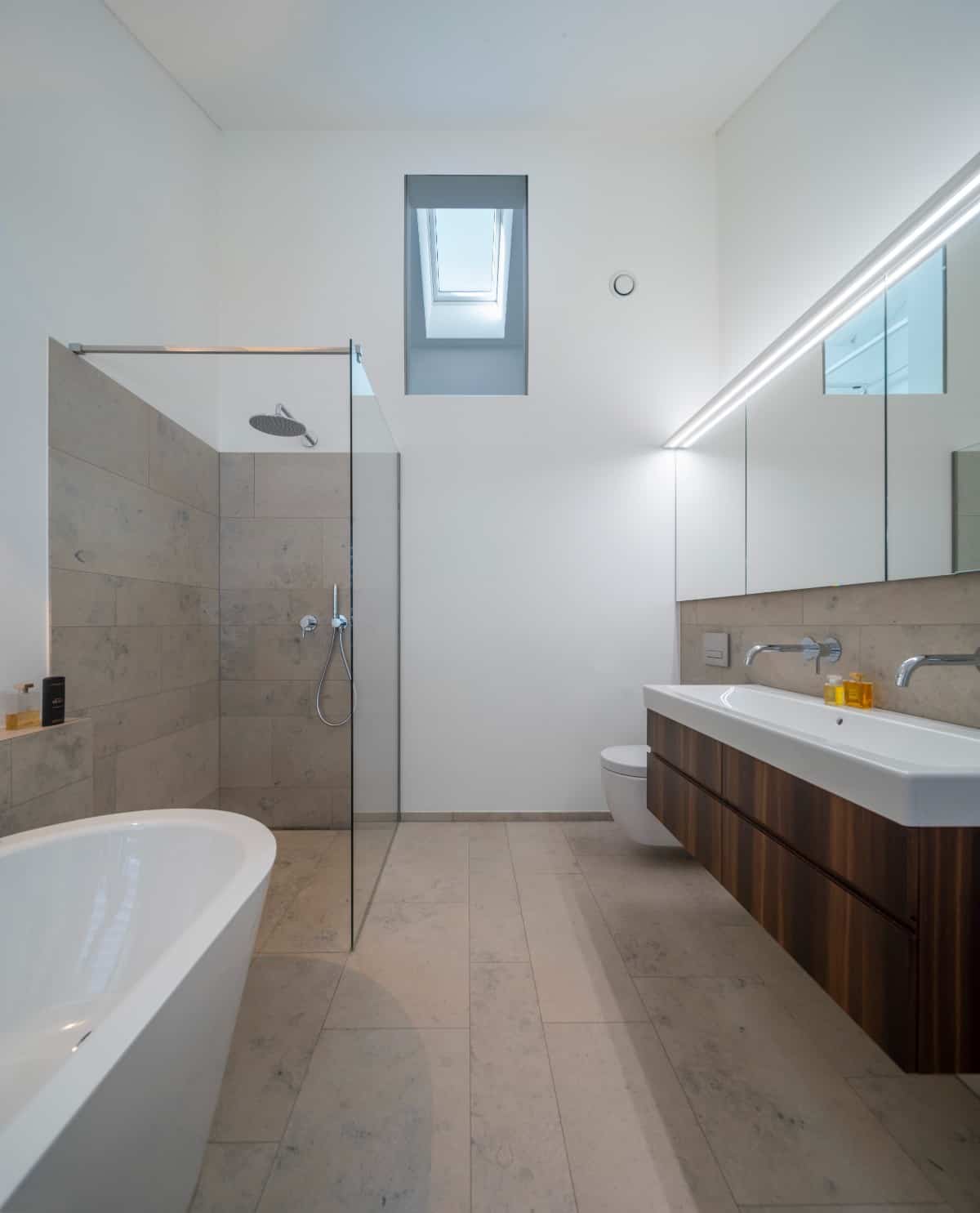 A skylight brings natural light into the bathroom.