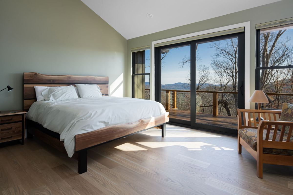 The master bedroom features fully retractable sliding doors, a bedroom deck that offers breathtaking mountain views.