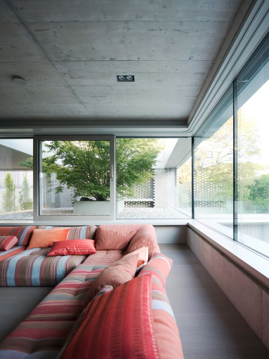 Another living area accessible from the street level that serves as a reception and guest welcome area. The glass-enclosed wall gives the living room an outdoor atmosphere.