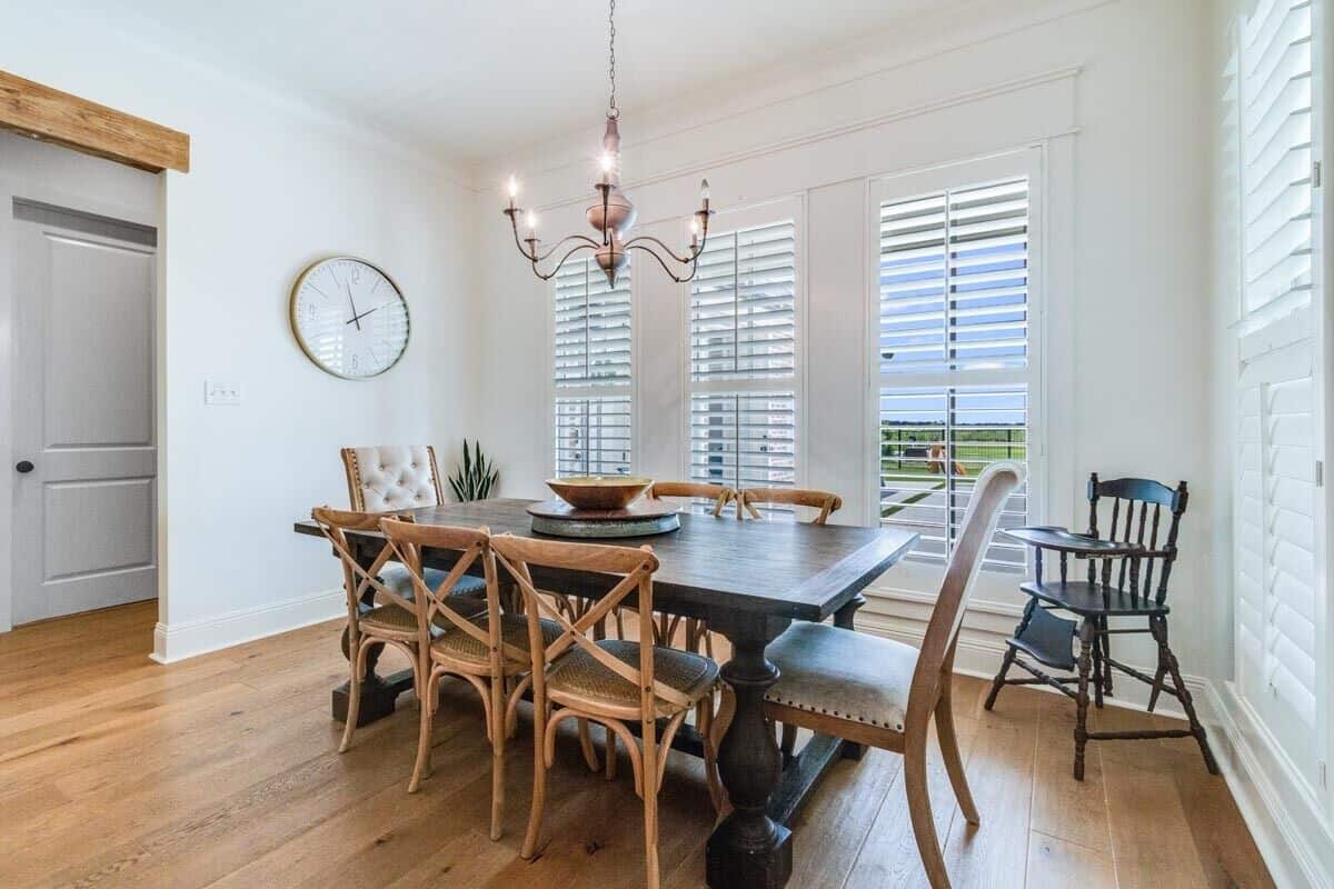 Surrounding windows bathe the dining room with ample natural light.