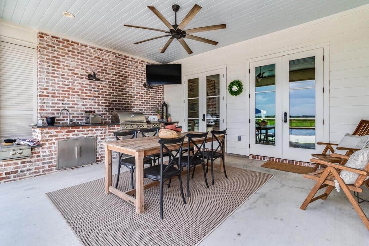 The covered porch also offers a great space for alfresco dining.