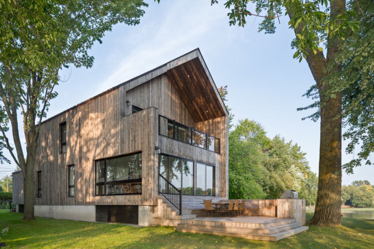 Spacious Exterior Wooden Cabin House of Chalet St. Placide by La Firme.