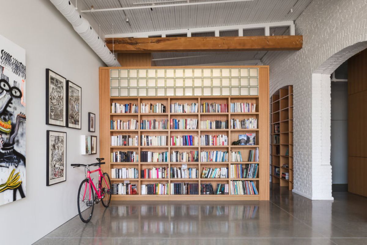 A built-in bookshelf with numerous open shelves.