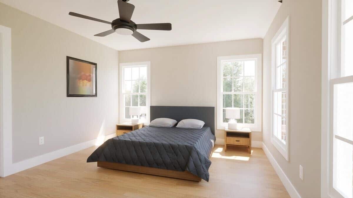 Large white-framed windows bring lots of natural light into this bedroom.