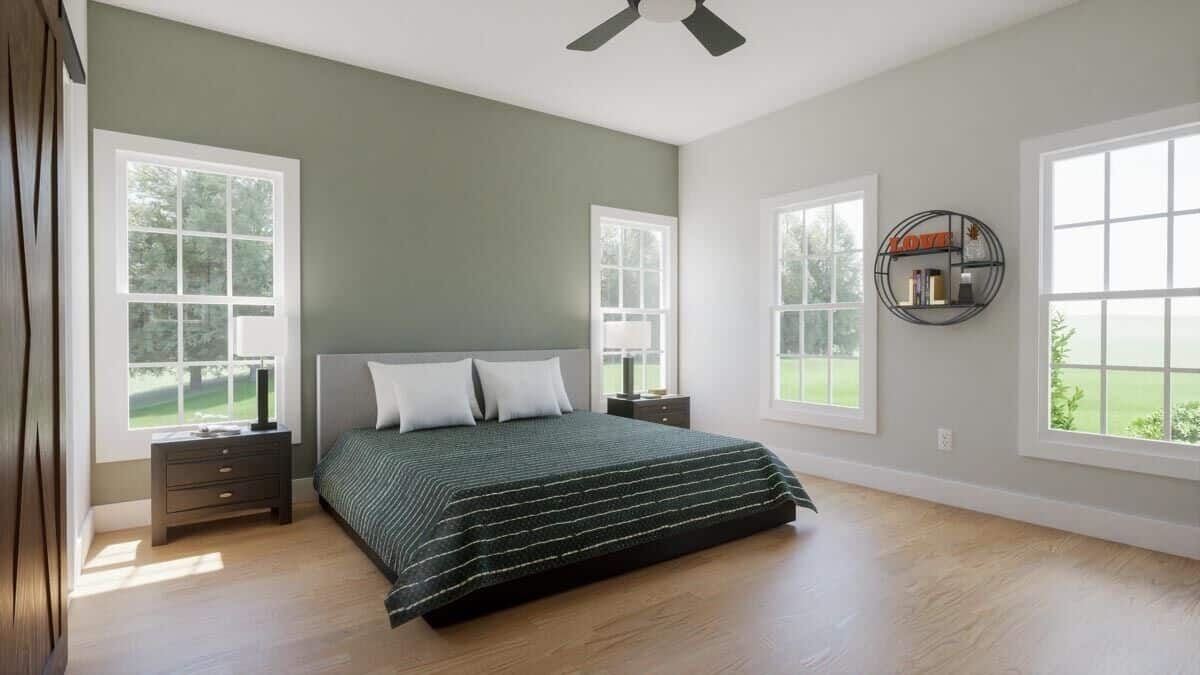 The primary bedroom has hardwood flooring and spectacular views of the front yard.