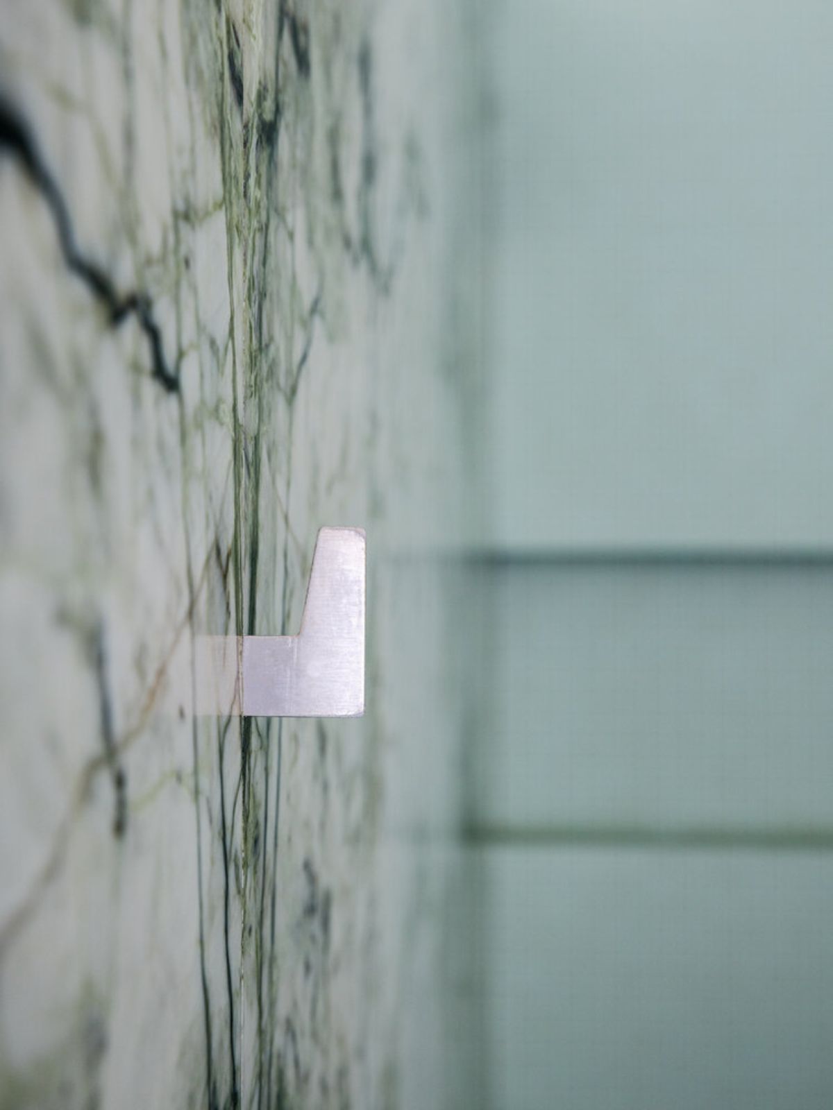 Shower room with ceramic marble wall tile.