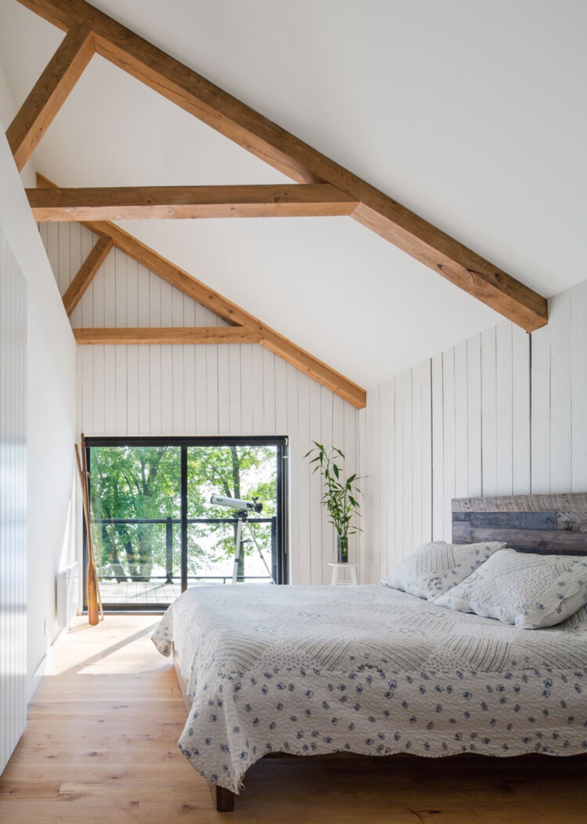 A cozy minimalist wooden cabin bedroom.