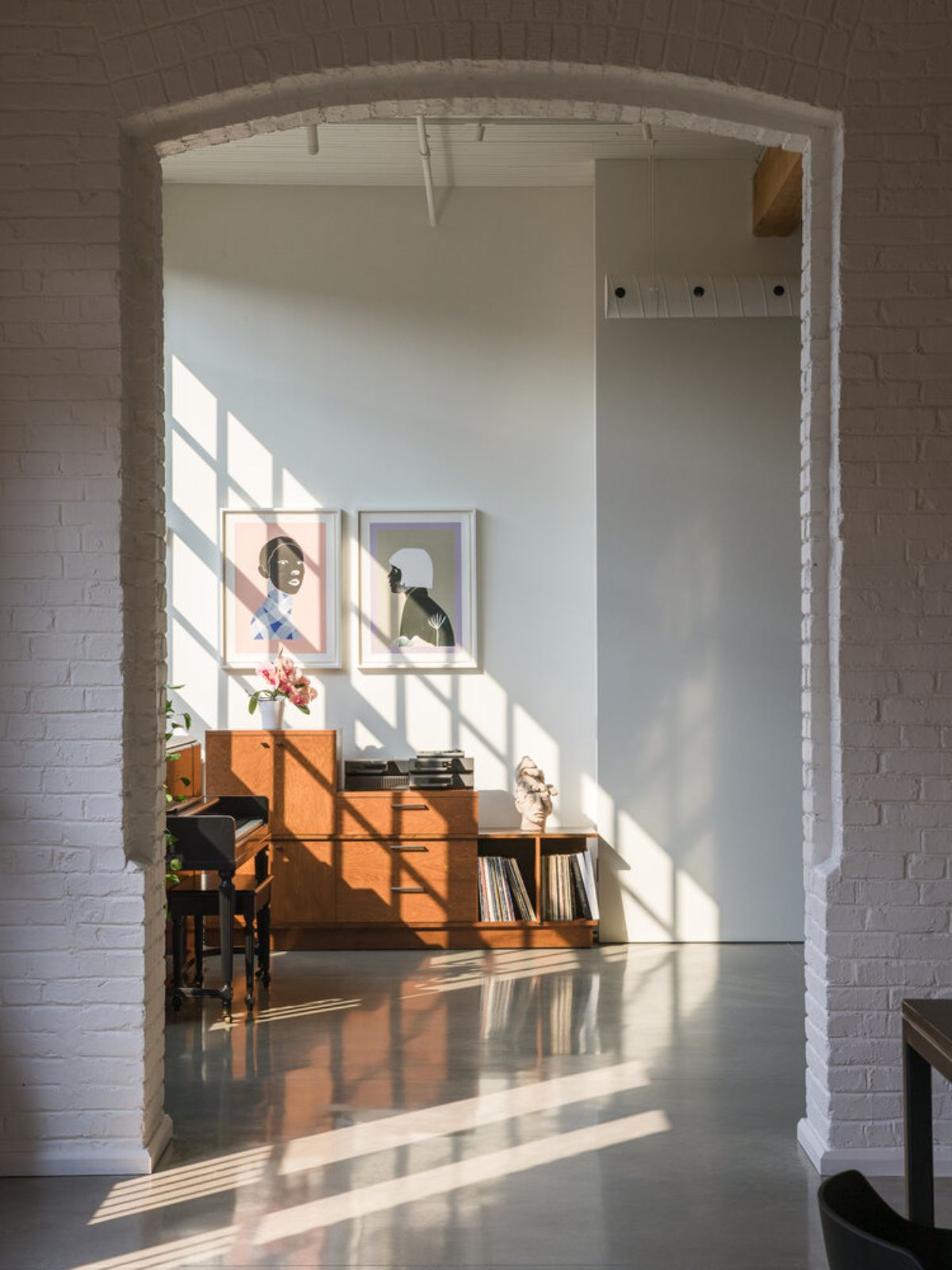 The sunlight passing through the window of the proportionally designed living room.