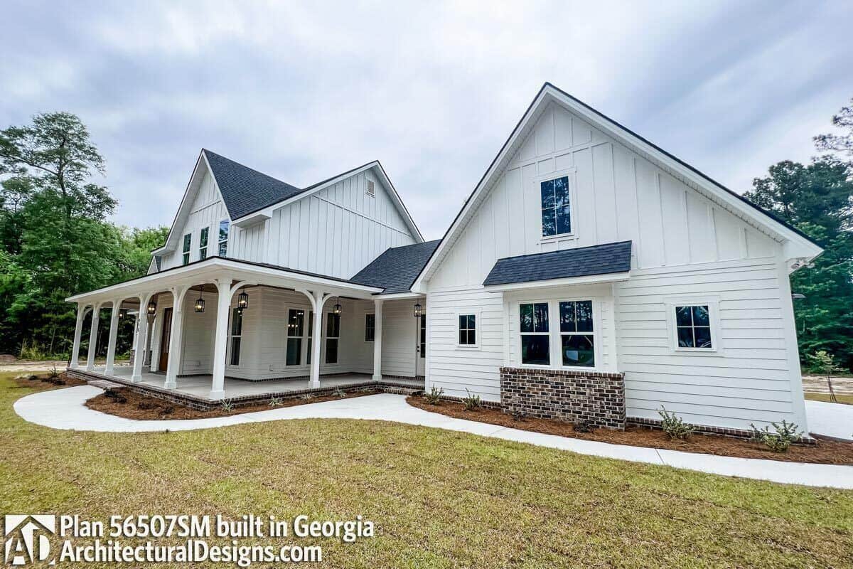 An angled front view showcasing the wraparound porch.