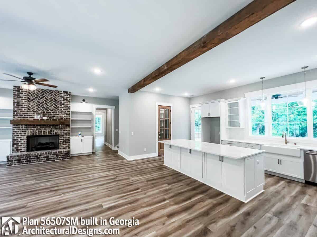 An oversized opening connects the great room and kitchen together.